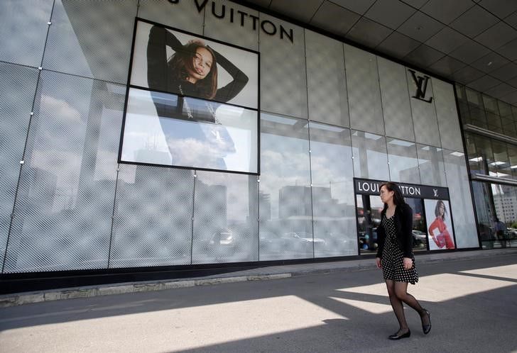 A woman walks past a Louis Vuitton shop near Genghis Square in downtown Ulan Bator, Mongolia June 27, 2016. u00e2u20acu201d Reuters pic