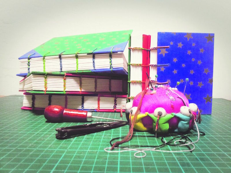 Coptic binding of books done by The Thistle Bindery. — TODAY pic