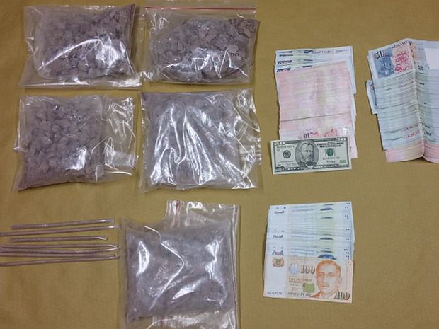 Heroin and cash seized during a CNB operation on July 27, 2016. u00e2u20acu201d Picture courtesy of CNB via TODAY