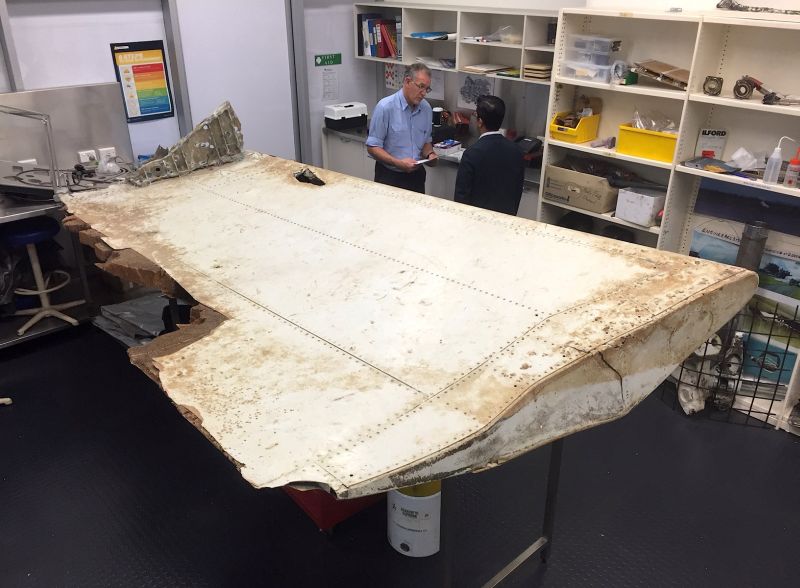Australian and Malaysian officials examine aircraft debris at the Australian Transport Safety Bureau headquarters in Canberra, Australia, July 20, 2016 after it was found on Pemba Island, located near Tanzania. u00e2u20acu2022 Reuters pic