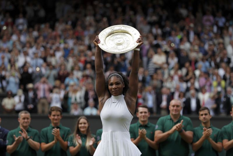 Wimbledon - All England Lawn Tennis & Croquet Club, Wimbledon, England - 9/7/16 USAu00e2u20acu2122s Serena Williams celebrates winning her womens singles final match against Germanyu00e2u20acu2122s Angelique Kerber with the trophy REUTERS/Andrew Couldridge