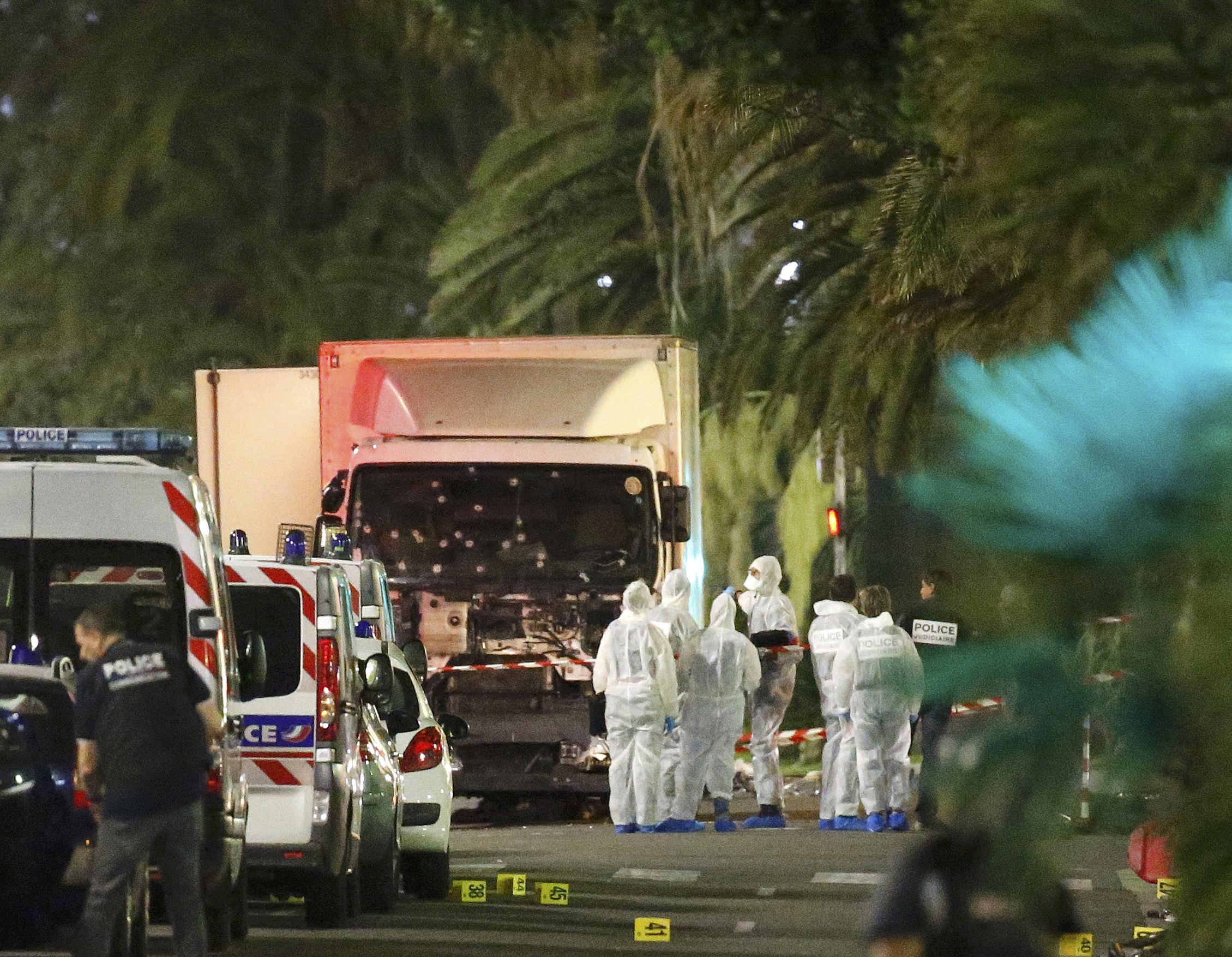 French police forces and forensic officers stand next to a truck July 15, 2016 that ran into a crowd celebrating the Bastille Day national holiday on the Promenade des Anglais killing at least 60 people in Nice, France, July 14. u00e2u20acu201d Reuters pic