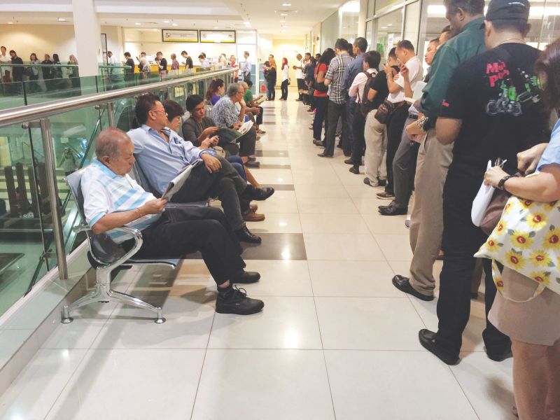 People are allowed in and a long line forms on the first floor where the immigration office is located.