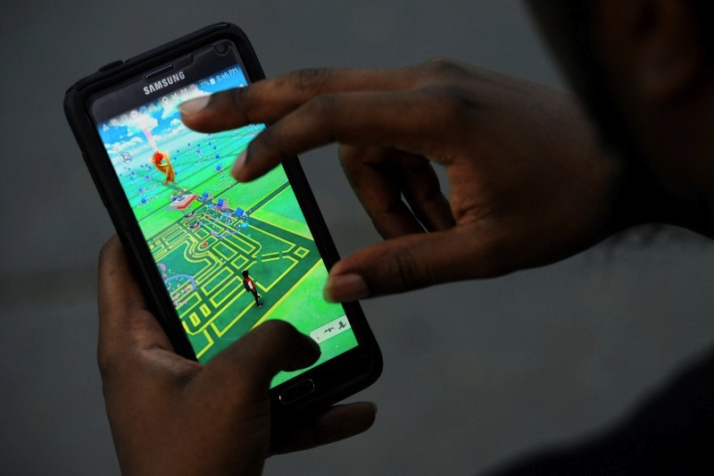 A virtual map of Bryant Park is displayed on the screen as a man plays the augmented reality mobile game 'Pokemon Go' by Nintendo in New York July 11, 2016. u00e2u20acu201d Reuters pic