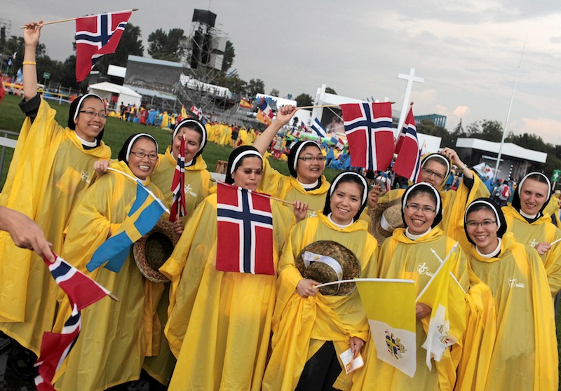 Nuns covered in rain coats gather before the opening mass of World Youth Day in Krakow, Poland July 26, 2016. u00e2u20acu201d Reuters pic