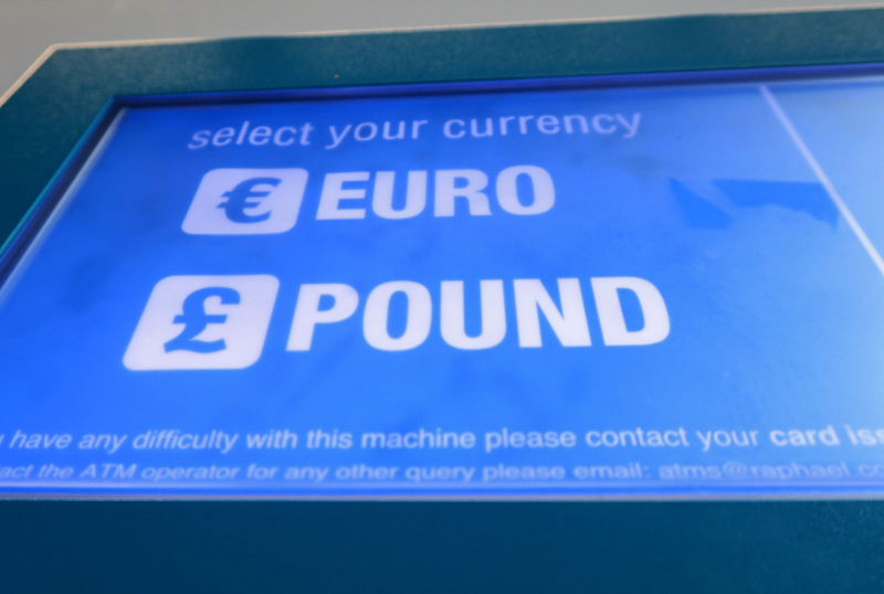 A cash machine ATM that offers withdrawals in either Pound Sterling or Euros is seen in Canary Wharf Financial centre in London, Britain, June 30, 2016. u00e2u20acu201d Reuters pic