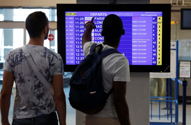 Passengers look an electronic board displaying flight information which announces the cancellation of a flight at the Marseille-Provence airport in Marignane on the first day of a strike by Air France stewards, France, July 27, 2016. u00e2u20acu201d Reuters pic