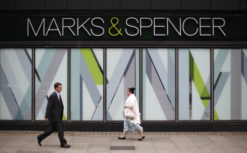 Pedestrians walk past a branch of Marks & Spencer in northwest London, Britain July 8, 2014. u00e2u20acu201d Reuters pic