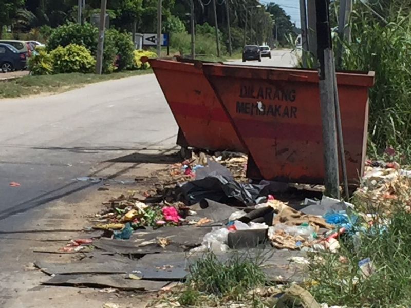 Bits and pieces of uncollected trash along Jalan Meru.