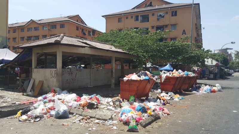 Uncollected garbage for weeks cast an ugly sight and smell for residents at a flat in Taman Bayu Perdana.