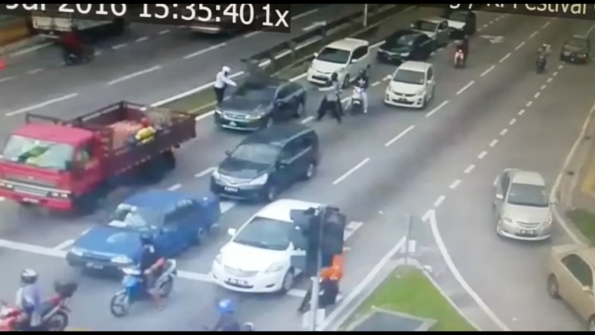 A video taken from a CCTV near the crime scene in Setapak, courtesy of a police source, shows gunmen open fire at a car in broad daylight this afternoon.