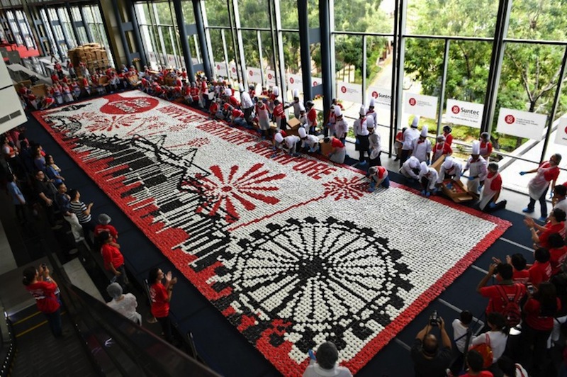 Volunteers on National Day in 2015. u00e2u20acu201d AFP pic