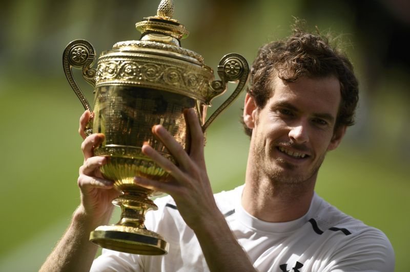 Great Britainu00e2u20acu2122s Andy Murray celebrates winning the mens singles final against Canadau00e2u20acu2122s Milos Raonic with the Wimbledon trophy at All England Lawn Tennis & Croquet Club, Wimbledon, England July 10, 2016. u00e2u20acu201d Reuters pic