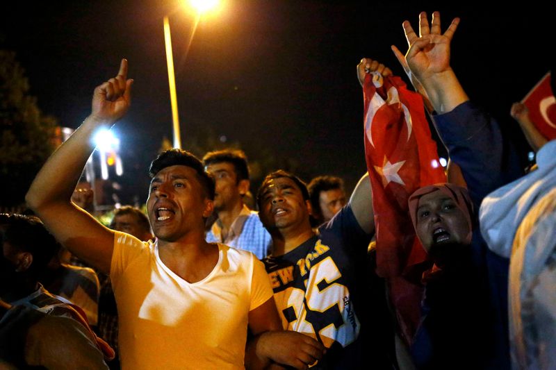 People chant near Turkish army troops in Ankara July 16, 2016. u00e2u20acu201d Reuters pic 