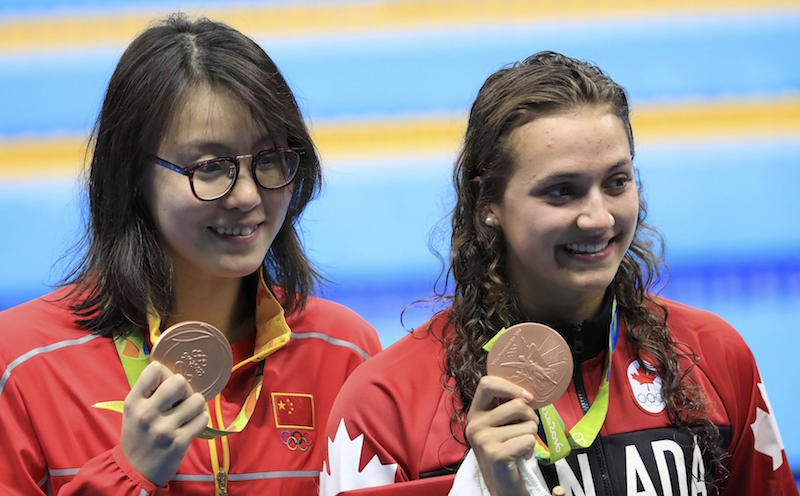 Kylie Masse of Canada and Fu Yuanhui of China pose with their bronze medals during the Womenu00e2u20acu2122s 100m Backstroke Victory Ceremony at the Olympic Aquatics Stadium in Rio de Janeiro August 8, 2016. u00e2u20acu201d Reuters pic