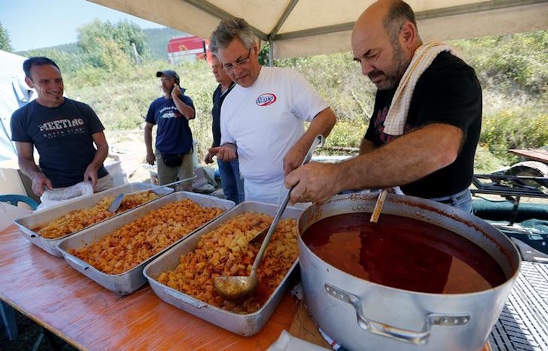 Volunteers prepare u00e2u20acu02dcAmatricianau00e2u20acu2122, a type of pasta dish created in Amatrice, at a tent camp in Santu00e2u20acu2122Angelo, following an earthquake in central Italy, August 28, 2016. u00e2u20acu201d Reuters pic