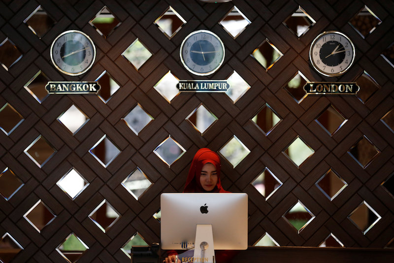 A receptionist works at the Al Meroz hotel in Bangkok August 29, 2016. u00e2u20acu201d Reuters pic 