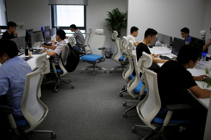Employees of WM Motor Technology Co, Ltd work at their office in shanghai, China, August 1, 2016. u00e2u20acu201d Reuters pic
