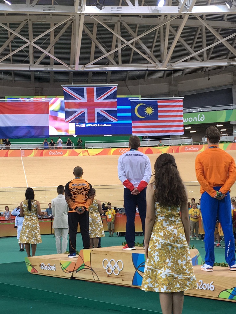 Bronze medallists Azizulhasni Awang watches as the Jalur Gemilang is raised after the men’s track cycling keirin, in Rio de Janeiro, Brazil Aug 16, 2016. — Picture courtesy of Kong Len Wei 
