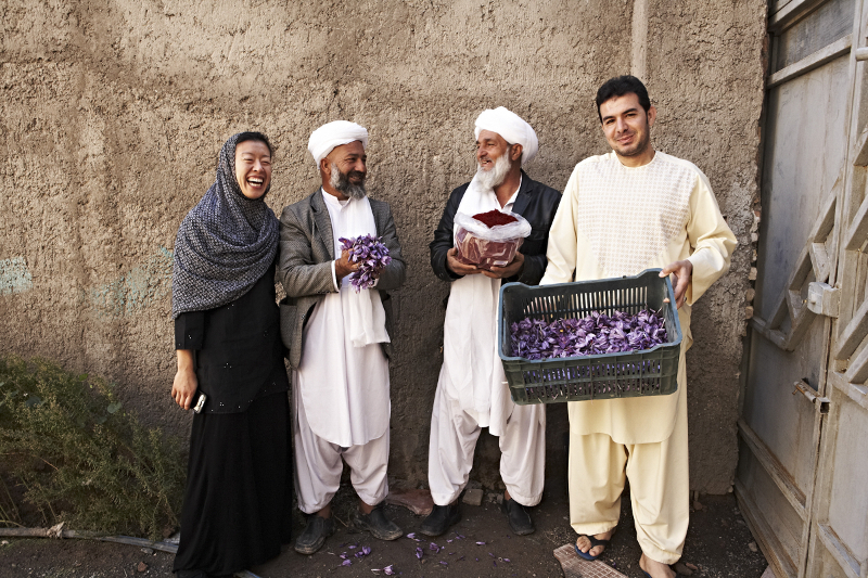 An undated handout photo of Rumi Spice founder Kimberly Jung (left) alongside two farmers and the processing plant manager Abdul Shakoor Ehrarri (right) in Herat, Afghanistan. u00e2u20acu201d Picture by Melanie Dunea via The New York Times
