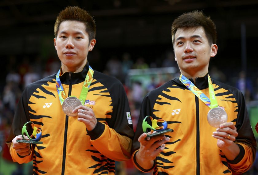 Malaysiau00e2u20acu2122s menu00e2u20acu2122s doubles pair, Goh V Shem and Tan Wee Kiong pose with their medals after the badminton final match at the Rio Olympics 2016 in Rio de Janeiro, August 20, 2016. u00e2u20acu201d Reuters pic