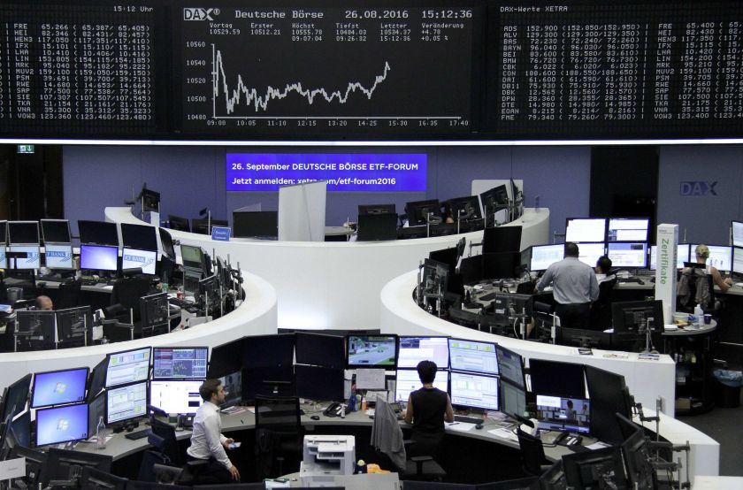 Traders work at their desks in front of the German share price index, DAX board, at the stock exchange in Frankfurt, Germany, August 27, 2016. u00e2u20acu201d Reuters pic
