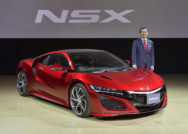 Honda CEO Takahiro Hachigo poses in front of the new Honda NSX, at its Japan launch event in Tokyo, Japan, in this photo taken by Kyodo August 25, 2016. u00e2u20acu201du00c2u00a0Reuters pic 