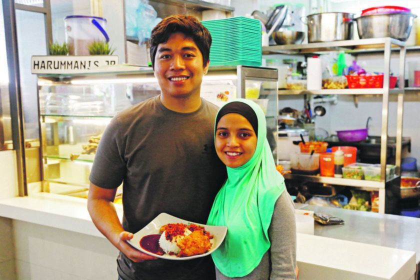 Mohamad Afiq Mohammed Anuar, 26, in front of his stall Harummanis Junior. u00e2u20acu201d TODAY pic