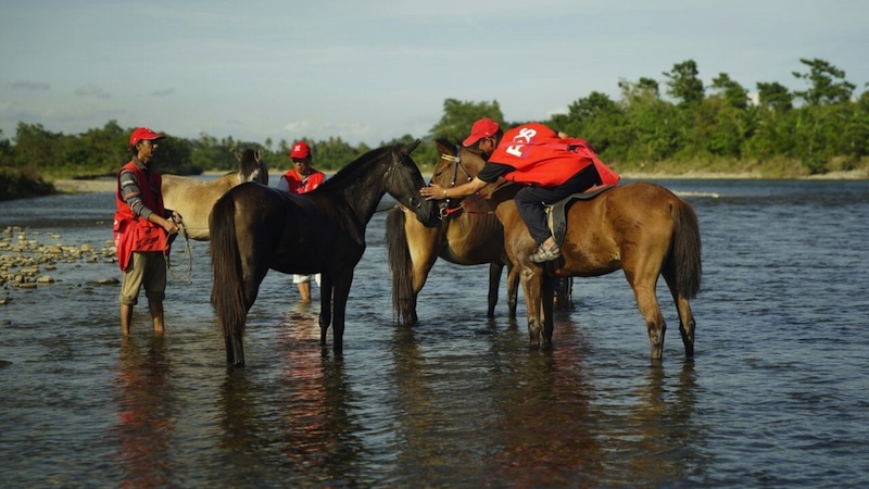 Three community postmen tending to their horses in Sungai Kg. Siai, Kota Belud, Sabah.u00c2u00a0u00e2u20acu201du00c2u00a0Picture courtesy of MCMC