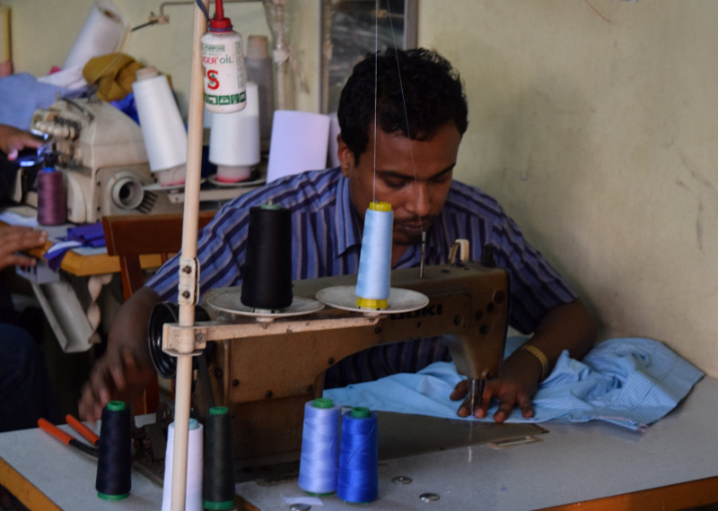 Rohingya refugee Muhammad Ayub sews clothes at a market in Kuala Lumpur, August 15, 2016. — Reuters pic