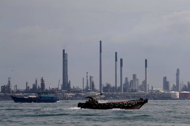 Boats sail past Pulau Bukom oil refinery along the southern coast of Singapore June 8, 2016. u00e2u20acu201d Reuters pic