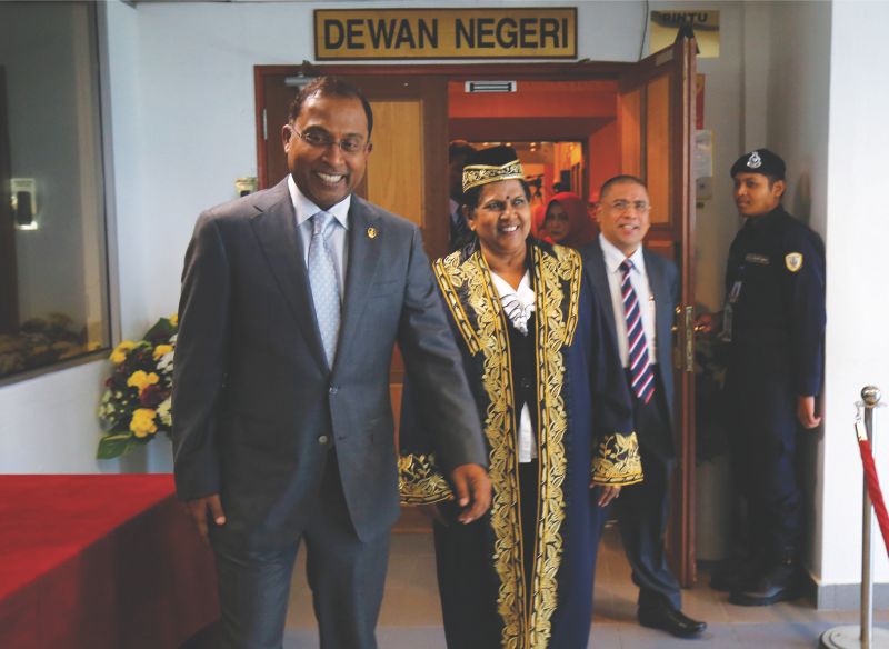 Perak Mentri Besar Datuk Seri Zambry Abd Kadir and Thangasvari (right) are all smiles as they walk out of the state assembly yesterday. u00e2u20acu201d Picture by Marcus Pheong 