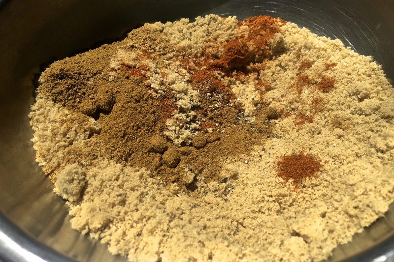 Mix of kosher salt, black pepper, brown sugar, cumin, coriander and cayenne for dry rub slow roasted pork ribs.