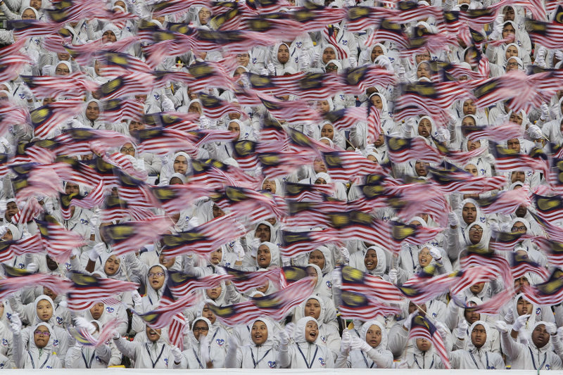 Participants waves Malaysian national flags during the Merdeka Day Parade at Dataran Merdeka, Kuala Lumpur August 31, 2016. u00e2u20acu201d Picture by Yusof Mat Isa