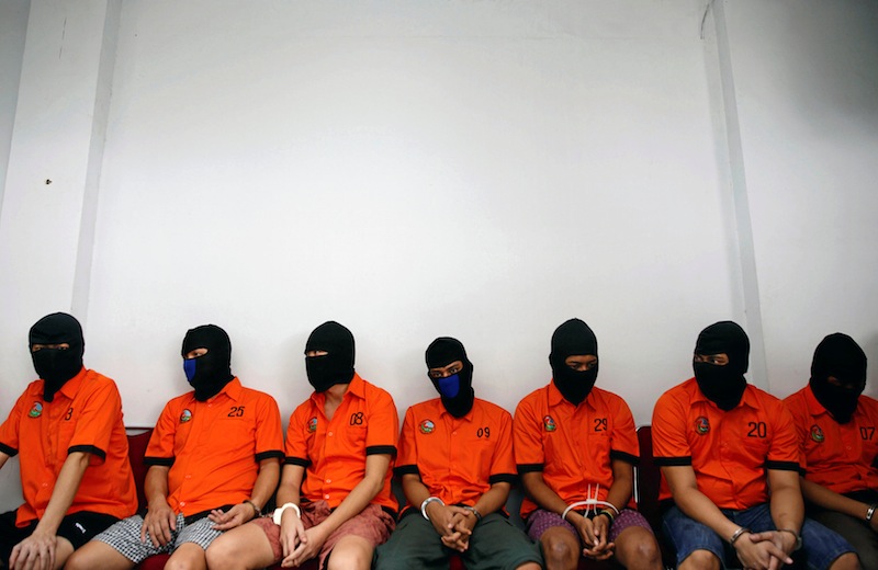 Recently arrested drug trafficking suspects, including foreigners, wait for the start of an illegal narcotics destruction event at police headquarters in Jakarta, Indonesia July 21, 2016. u00e2u20acu201d Reuters pic