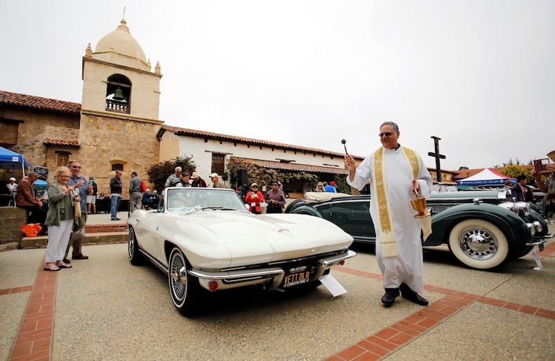 Bishop Richard Garcia blesses a 1965 Corvette, owned by Mike Vietro, during the Carmel Mission Classic, in Carmel-by-the-Sea, California, US August 17, 2016. u00e2u20acu201d Reuters pic 