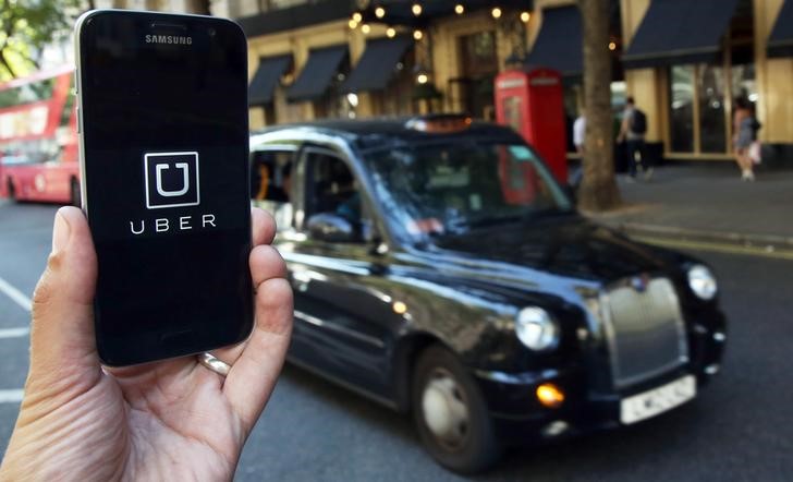 A photo illustration shows the Uber app logo displayed on a mobile telephone, as it is held up for a posed photograph in central London, Britain August 17, 2016. u00e2u20acu201d Reuters pic 