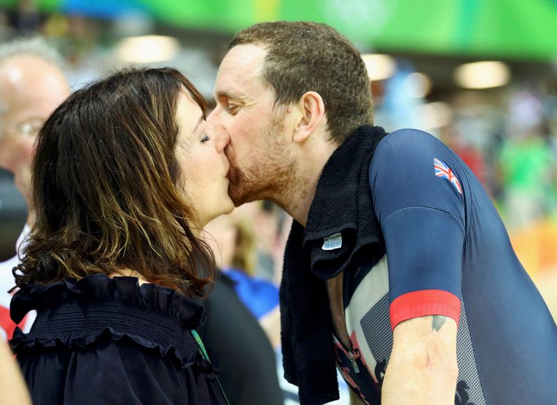 Bradley Wiggins of Britain kisses his wife Catherine as he celebrates winning the race and setting a new world record in the men's team pursuit at the Rio Olympic Velodrome, Rio de Janeiro August 12, 2016. u00e2u20acu201d Reuters pic