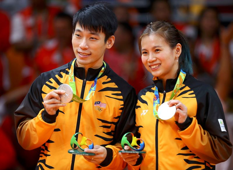 Silver medallists Chan Peng Soon and Goh Liu Ying Goh of Malaysia pose on the podium at the Riocentro Pavilion 4, Rio de Janeiro August 17, 2016. u00e2u20acu201d Reuters pic