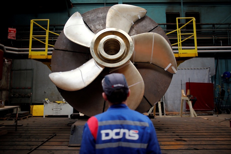 An employee looks at the propeller of a Scorpene submarine at the industrial site of the naval defence company and shipbuilder DCNS in La Montagne near Nantes, France, April 26, 2016. u00e2u20acu201d Reuters pic 