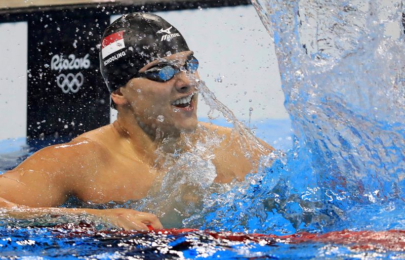 Joseph Schooling of Singapore celebrates winning the gold medal in the men's 100m butterfly at the Olympic Aquatics Stadium, Rio de Janeiro August 12, 2016. u00e2u20acu201d Reuters pic