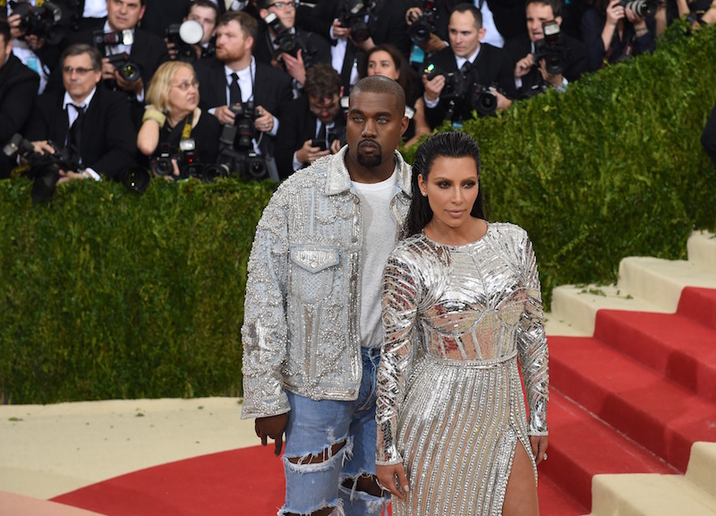 Kanye West, seen with Kim Kardashian, sports a metallic bomber jacket at the 2016 MET Gala. u00e2u20acu201d AFP pic