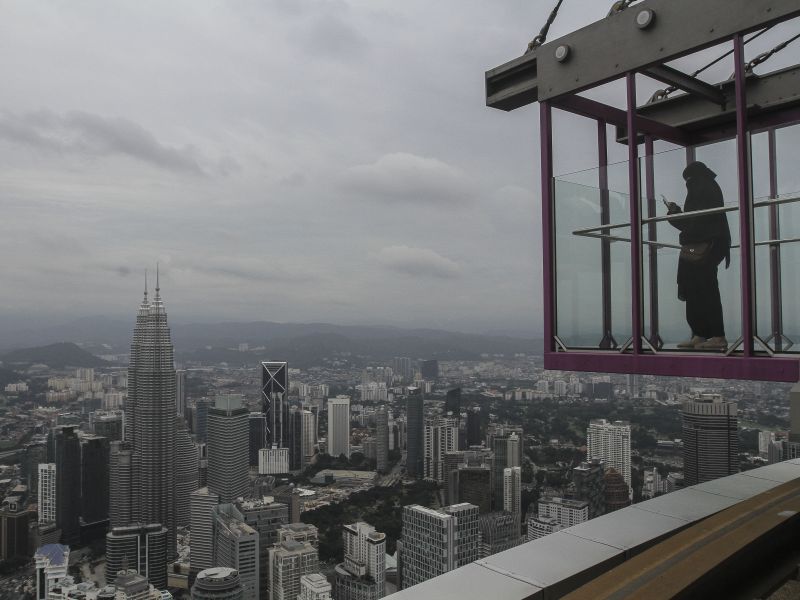The city of Kuala Lumpur is an expensive place to live in... and many graduates find that their degrees no longer guarantee them high-paying jobs. ― File pic