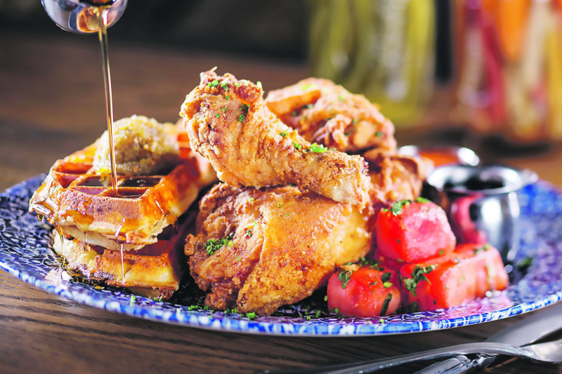 Fried chicken fans should try Yardbird Southern Table & Baru00e2u20acu2122s famed Lewellynu00e2u20acu2122s Fried Chicken, served with spiced watermelon and savoury waffles. u00e2u20acu201d Picture by Yardbird Southern Table & Bar via TODAY