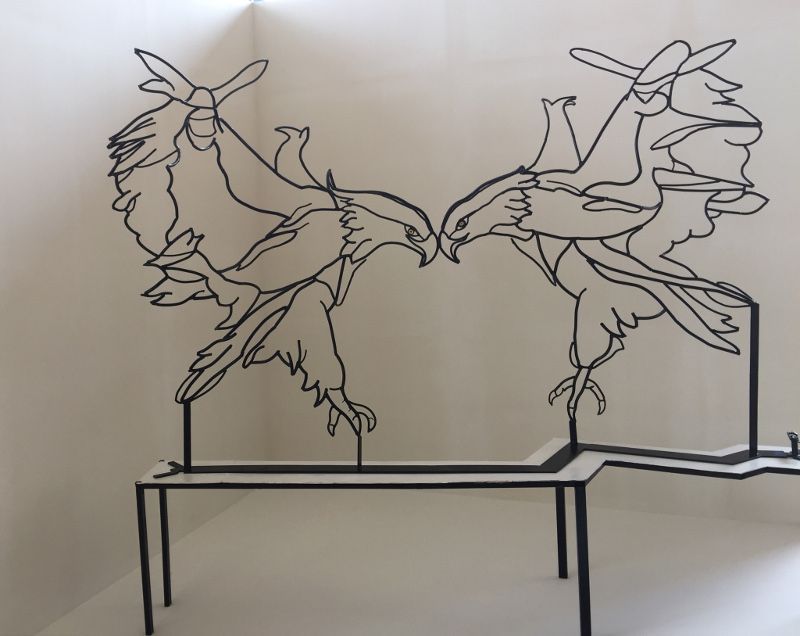 The King of Drones with two eagles on one side and a drone on the other side.