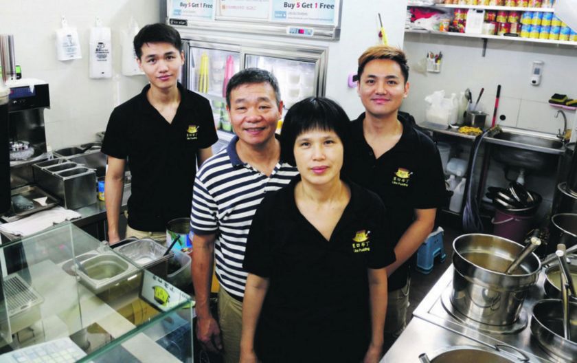 (From left) Chen Li Wei, 22, Chen Hsien Yi, 56, Ho Mei Hua, 52, and Kelvin Chen, 32, standing in their stall, Like Pudding. — TODAY pic