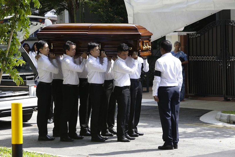 The body of S.R. Nathan being carried into his family home on Tuesday morning.u00c2u00a0u00e2u20acu201d TODAY pic