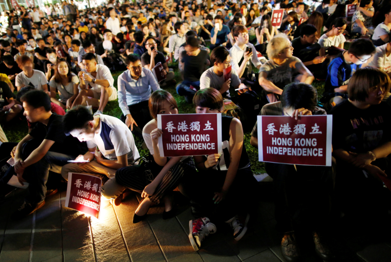 Protesters hold placards during a rally in support of independence advocates who have been barred from the Legislative Council elections in Hong Kong, China August 5, 2016. u00e2u20acu201d Reuters pic