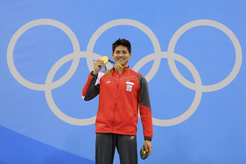 Joseph Schooling holding up his Olympic Gold medal. u00e2u20acu201d Reuters pic