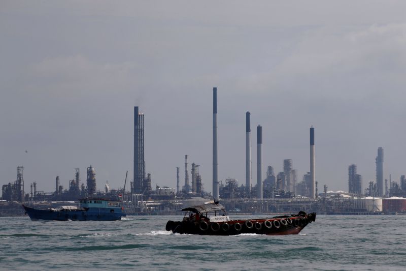Boats sail past Pulau Bukom oil refinery along the southern coast of Singapore June 8, 2016. u00e2u20acu2022 Reuters pic